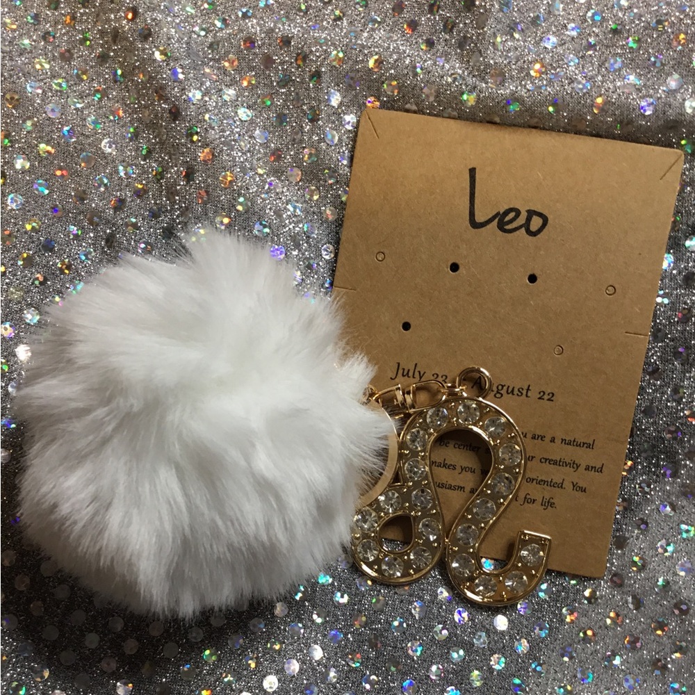 Chic White Pom Pom Keychain with Gold Leo Charm